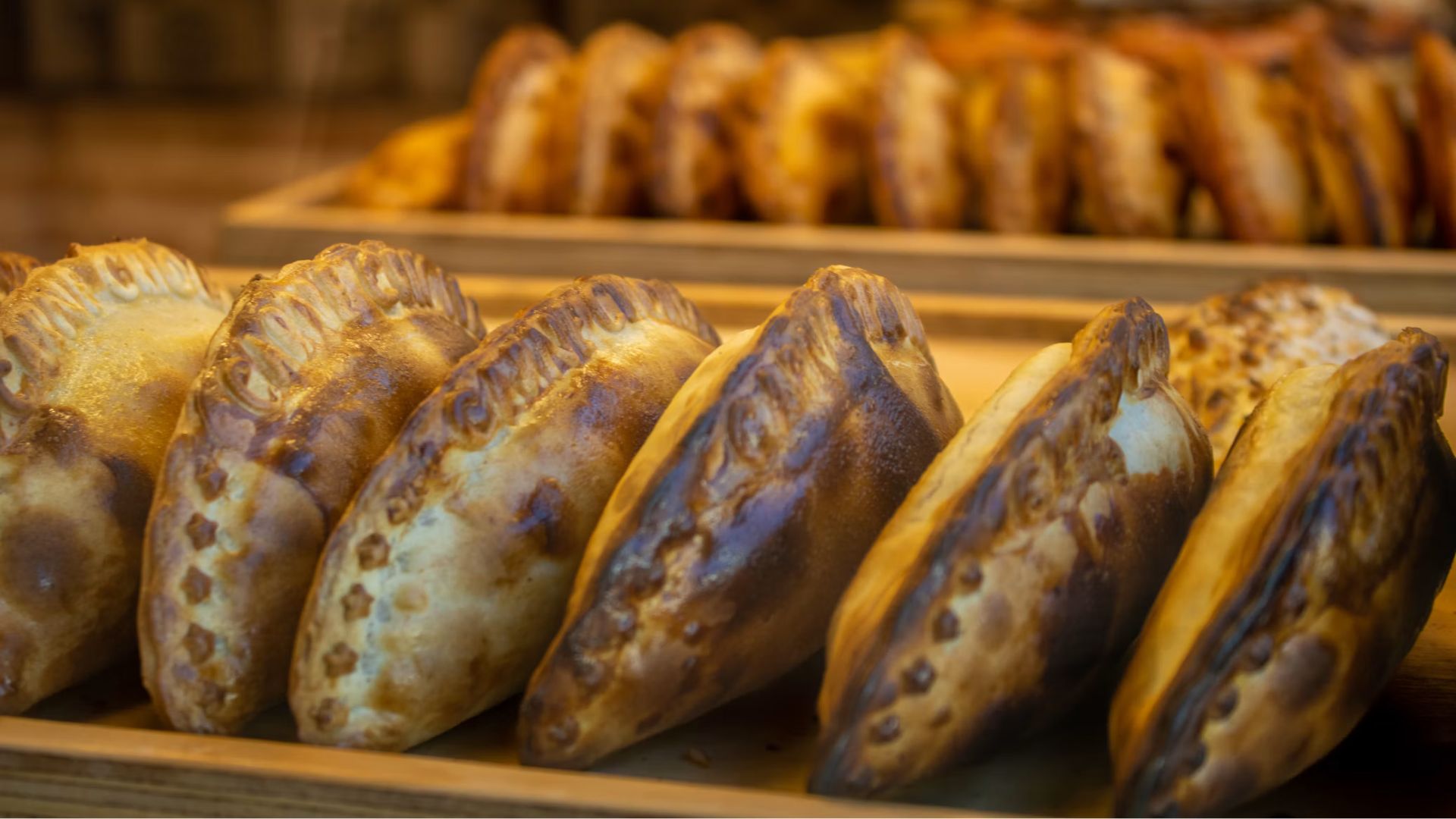 Cornish miners carried the pasty tradition to the region in the nineteenth century. The thick crust made it useful for a working lunch, and families adapted the filling to local ingredients and habits. Today, residents have strong opinions about which crust is best, whether rutabaga belongs inside and what should go on top.